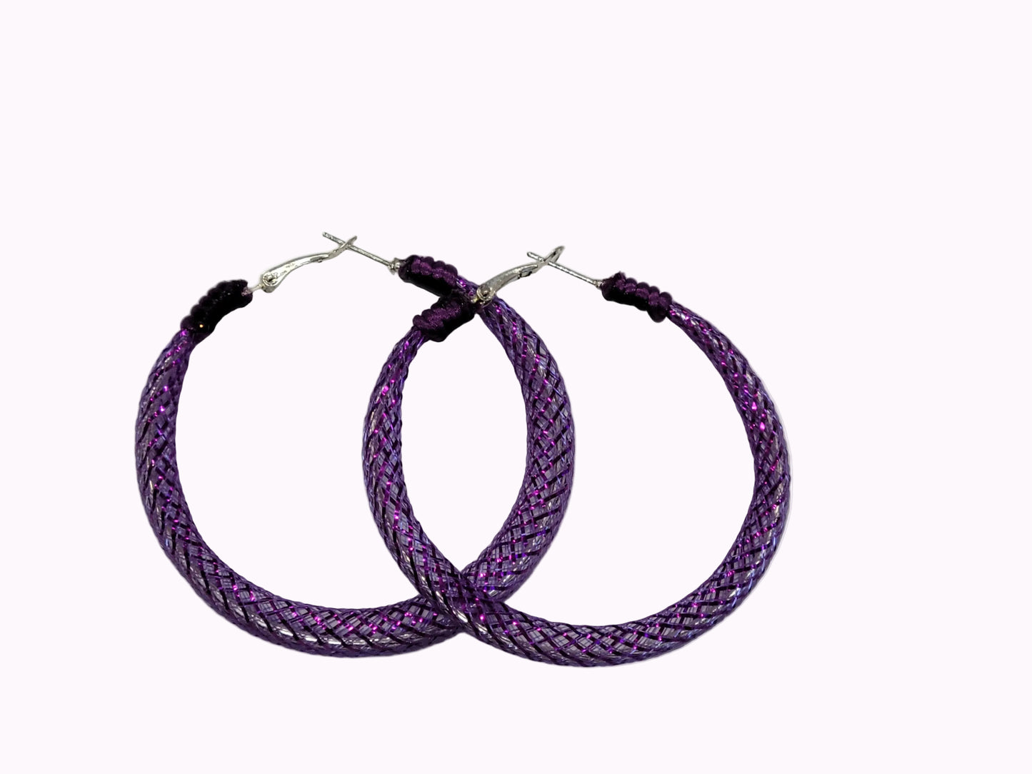 Purple braided lace hoop earrings on a gray background