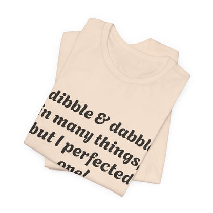 Minding My Business Tee — “I dibble & dabble in many things, but I perfected one!” Graphic T‑Shirt