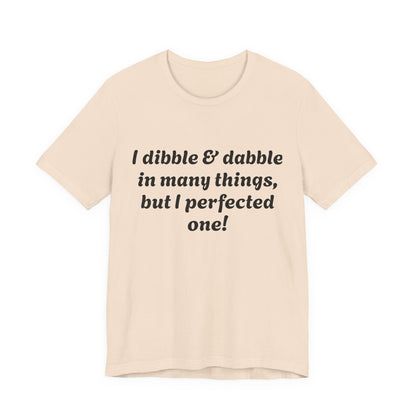 Minding My Business Tee — “I dibble & dabble in many things, but I perfected one!” Graphic T‑Shirt