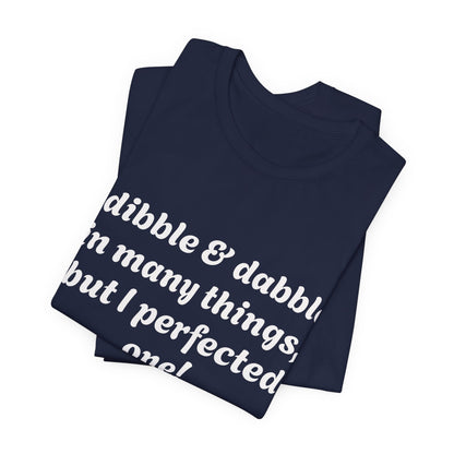 Minding My Business Tee — “I dibble & dabble in many things, but I perfected one!” Graphic T‑Shirt