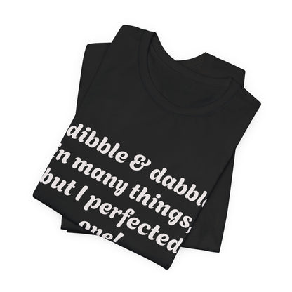 Minding My Business Tee — “I dibble & dabble in many things, but I perfected one!” Graphic T‑Shirt